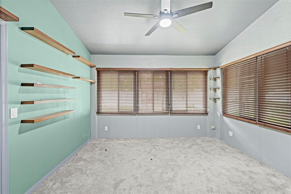 7492 Aloe Drive Spring Hill, FL 34607 - Photo 36 of 57 a view of empty room with window and ceiling fan