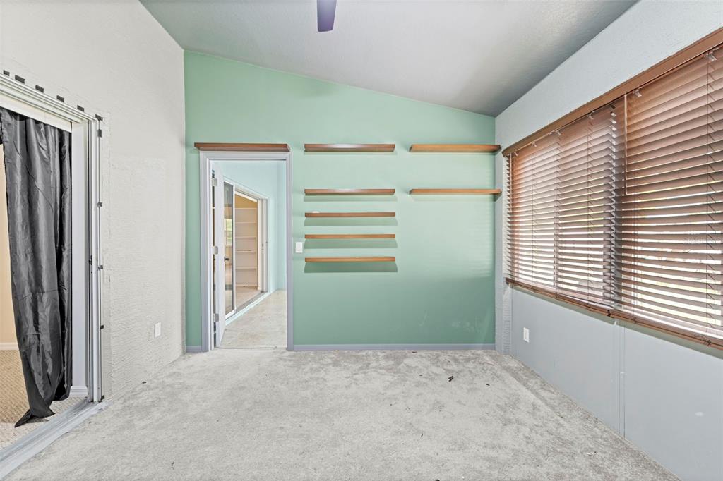 7492 Aloe Drive Spring Hill, FL 34607 - Photo 38 of 57 a view of empty room with window and refrigerator