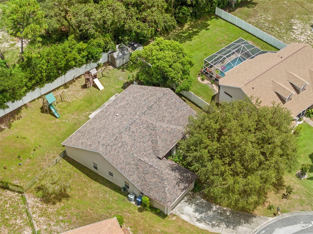 7492 Aloe Drive Spring Hill, FL 34607 - Photo 41 of 57 a view of a yard with an outdoor seating
