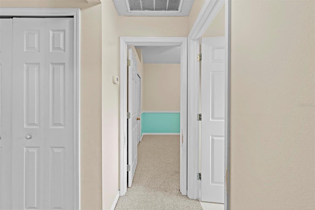7492 Aloe Drive Spring Hill, FL 34607 - Photo 45 of 57 a view of a hallway with rooms
