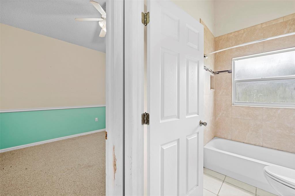 7492 Aloe Drive Spring Hill, FL 34607 - Photo 46 of 57 a bathroom with a shower and a tub