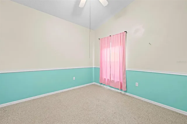 a view of a swimming pool with some potted plants by side of it