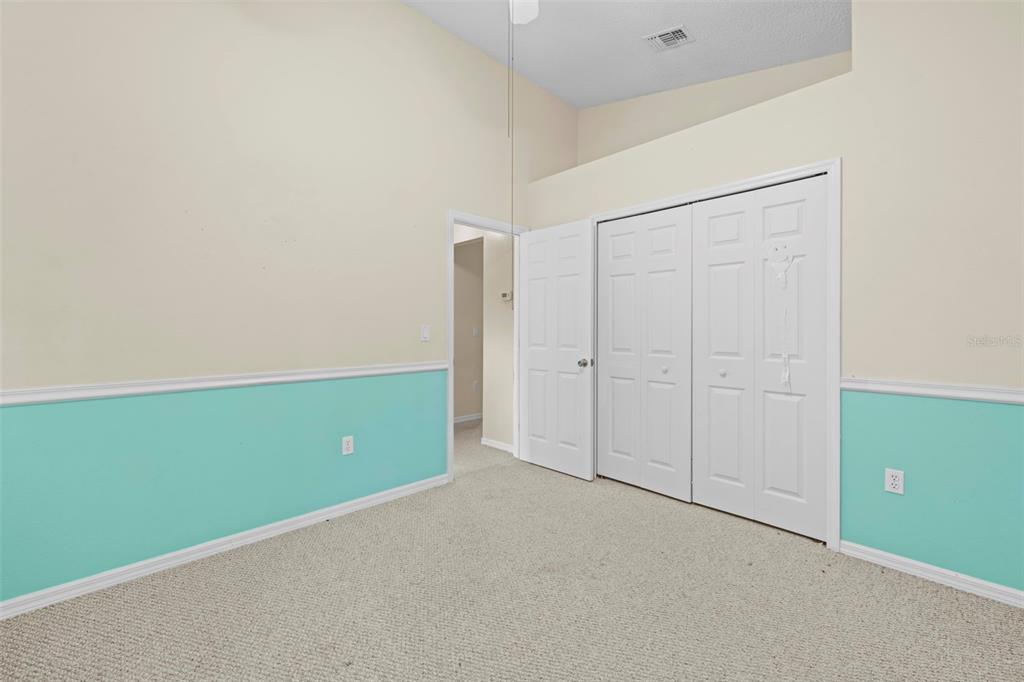 7492 Aloe Drive Spring Hill, FL 34607 - Photo 49 of 57 an empty room with closet and a window