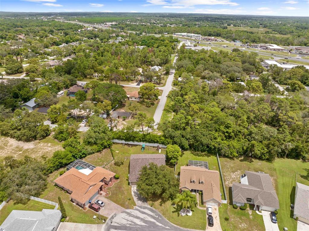 7492 Aloe Drive Spring Hill, FL 34607 - Photo 51 of 57 an aerial view of residential houses with outdoor space