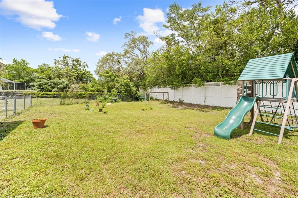 7492 Aloe Drive Spring Hill, FL 34607 - Photo 54 of 57 a swimming pool with wooden fence