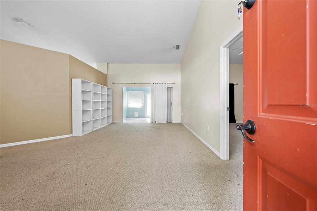 7492 Aloe Drive Spring Hill, FL 34607 - Photo 6 of 57 a view of empty room with a fireplace