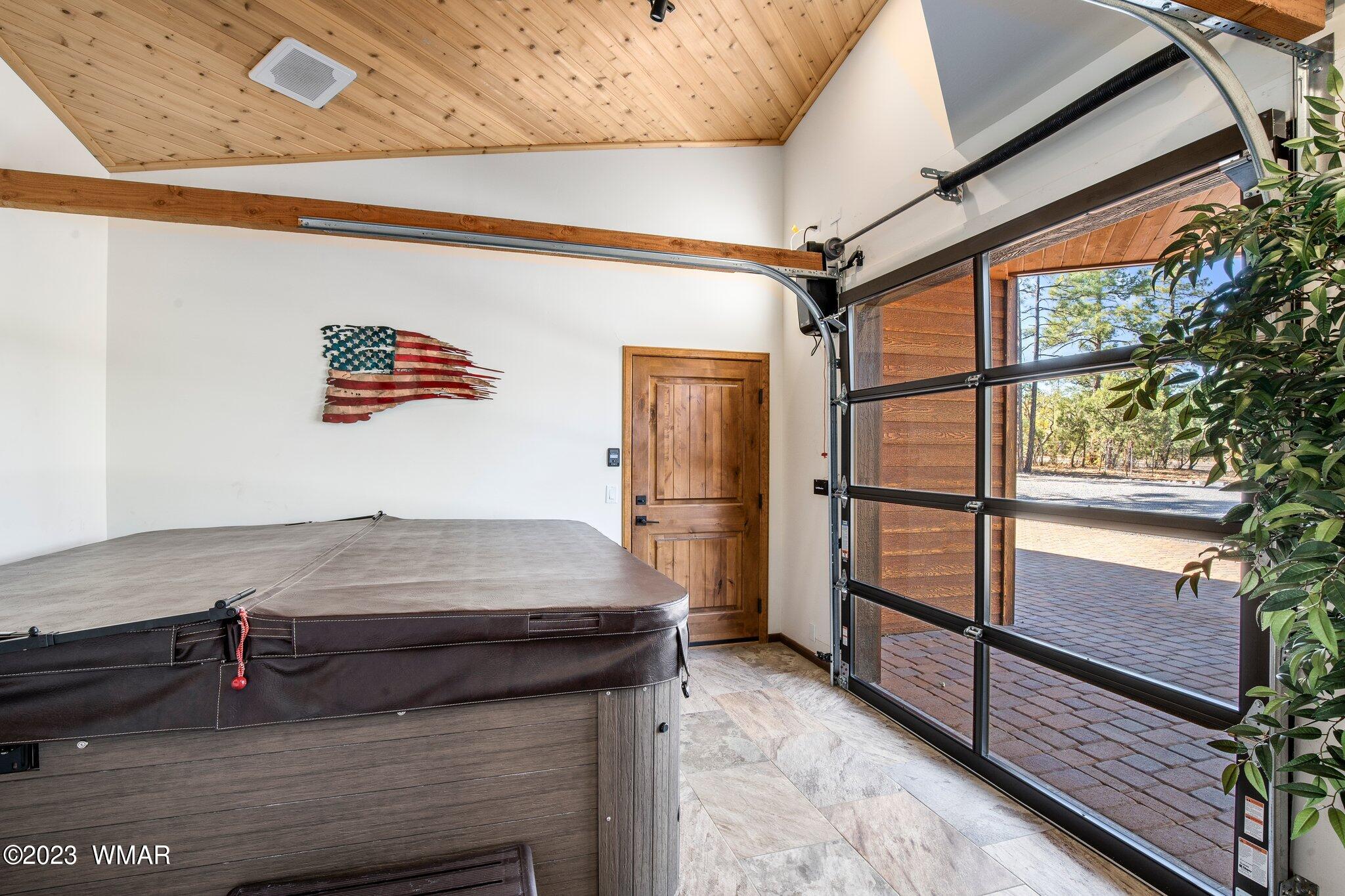 1591 South Falling Leaf Road Show Low, AZ 85901 - Photo 31 of 56 Spa Enclosure with Roll Up Door