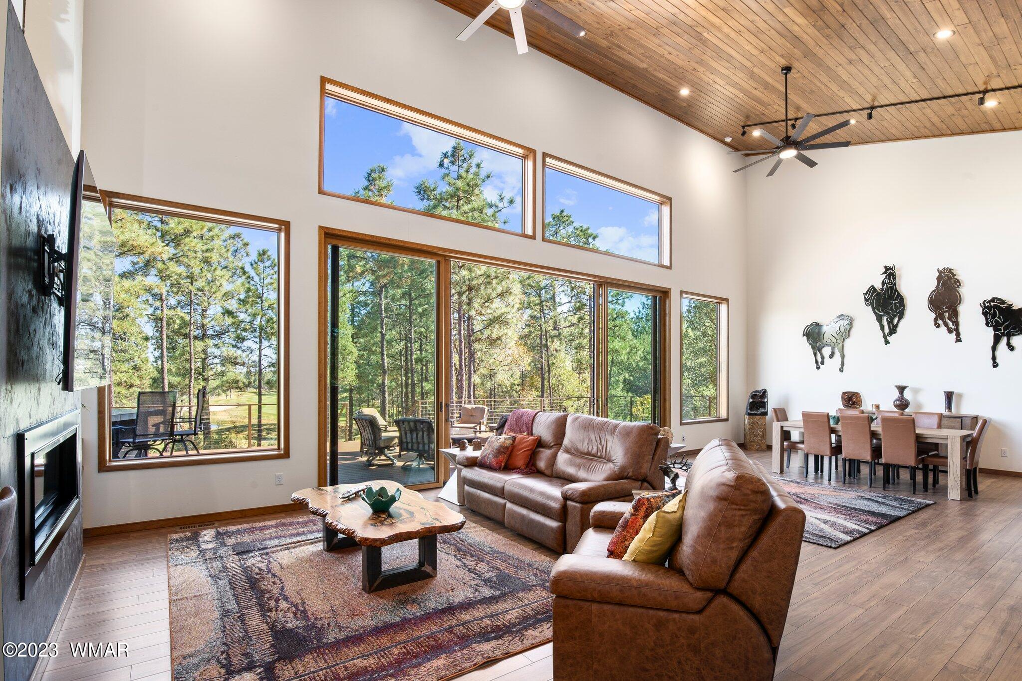 1591 South Falling Leaf Road Show Low, AZ 85901 - Photo 7 of 56 This great room with soaring ceilings and windows galore, truly is the heart of the home.