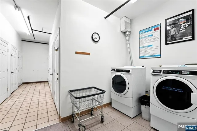 a view of a hallway with washer and dryer