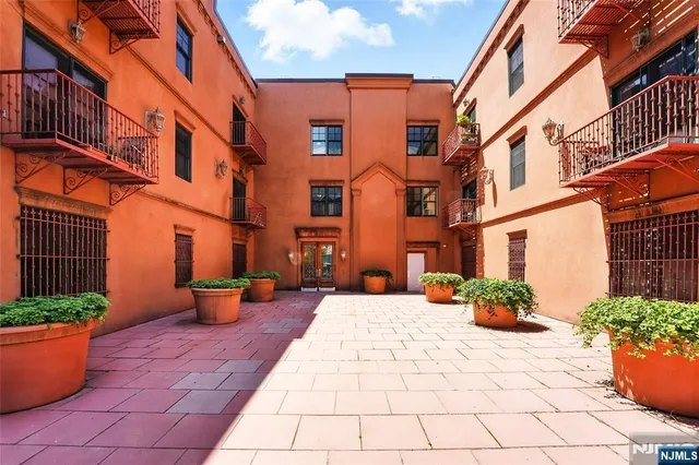 a view of a building with potted plants