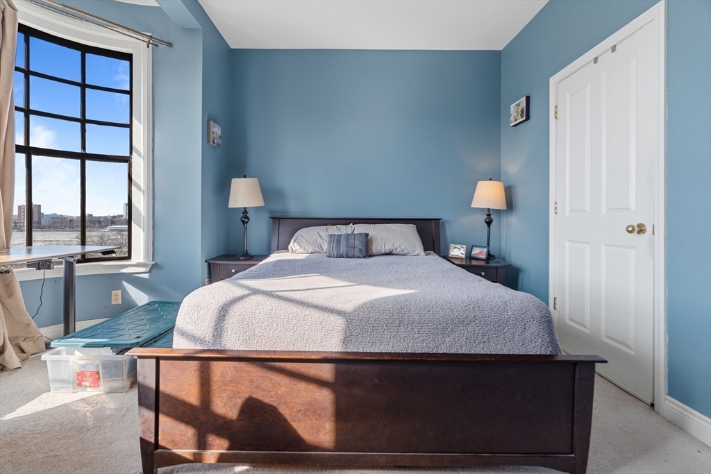 4 Charlesgate East, Unit 606 Boston, MA 02215 - Photo 13 of 25 a bedroom with a bed and window