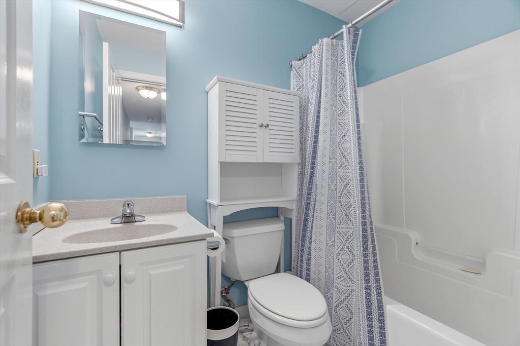 4 Charlesgate East, Unit 606 Boston, MA 02215 - Photo 16 of 25 a bathroom with a sink a toilet and shower