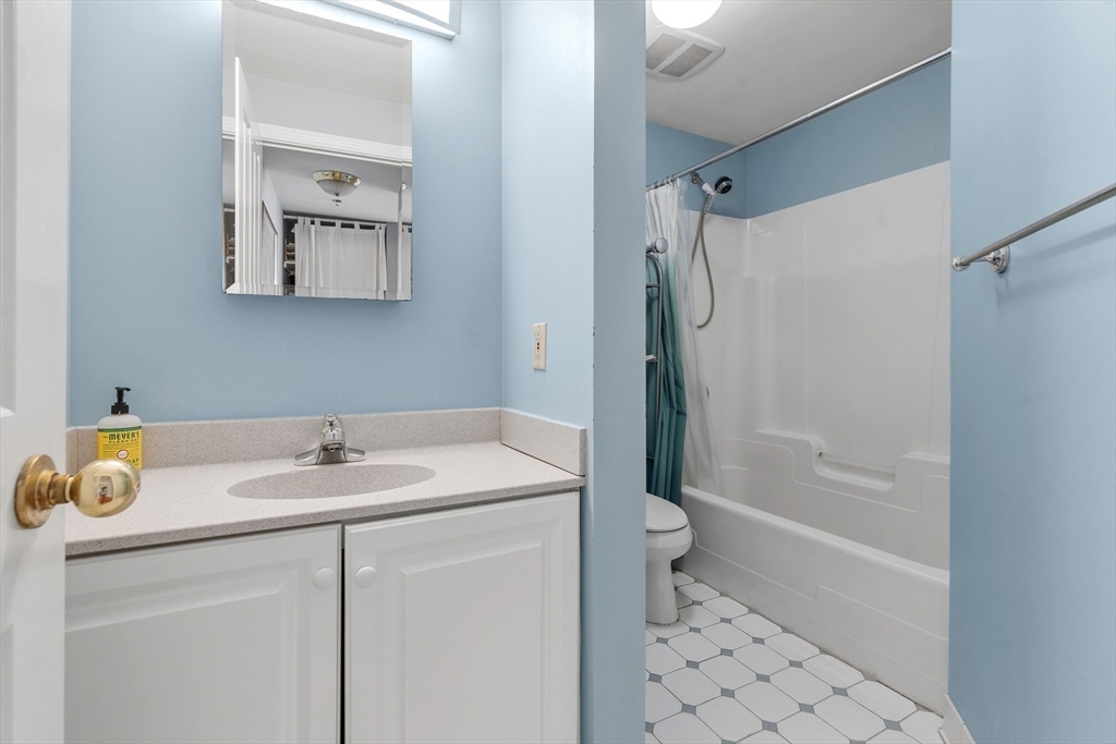 4 Charlesgate East, Unit 606 Boston, MA 02215 - Photo 19 of 25 a bathroom with a sink a toilet and shower