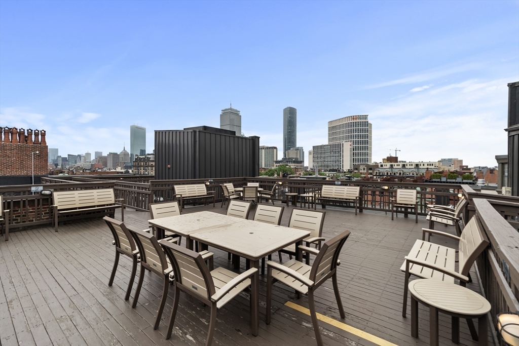 4 Charlesgate East, Unit 606 Boston, MA 02215 - Photo 20 of 25 a view of a terrace with furniture and a kitchen