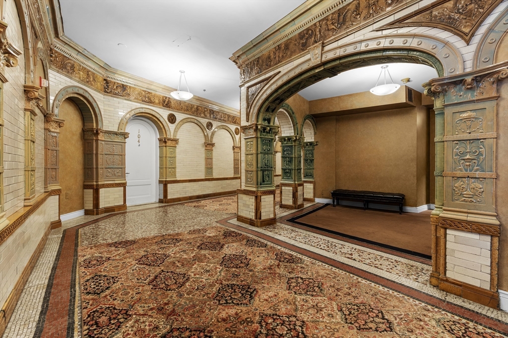 4 Charlesgate East, Unit 606 Boston, MA 02215 - Photo 24 of 25 a bathroom with a granite countertop sink and a mirror