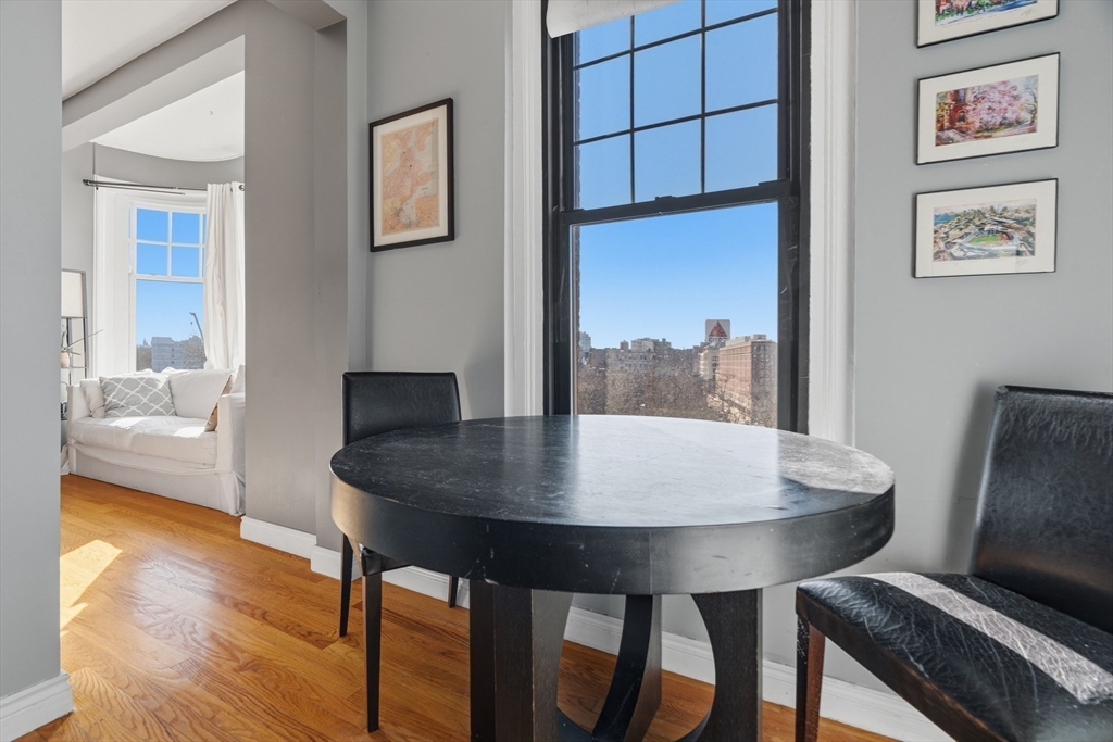 4 Charlesgate East, Unit 606 Boston, MA 02215 - Photo 9 of 25 a view of a dining room with furniture window and wooden floor
