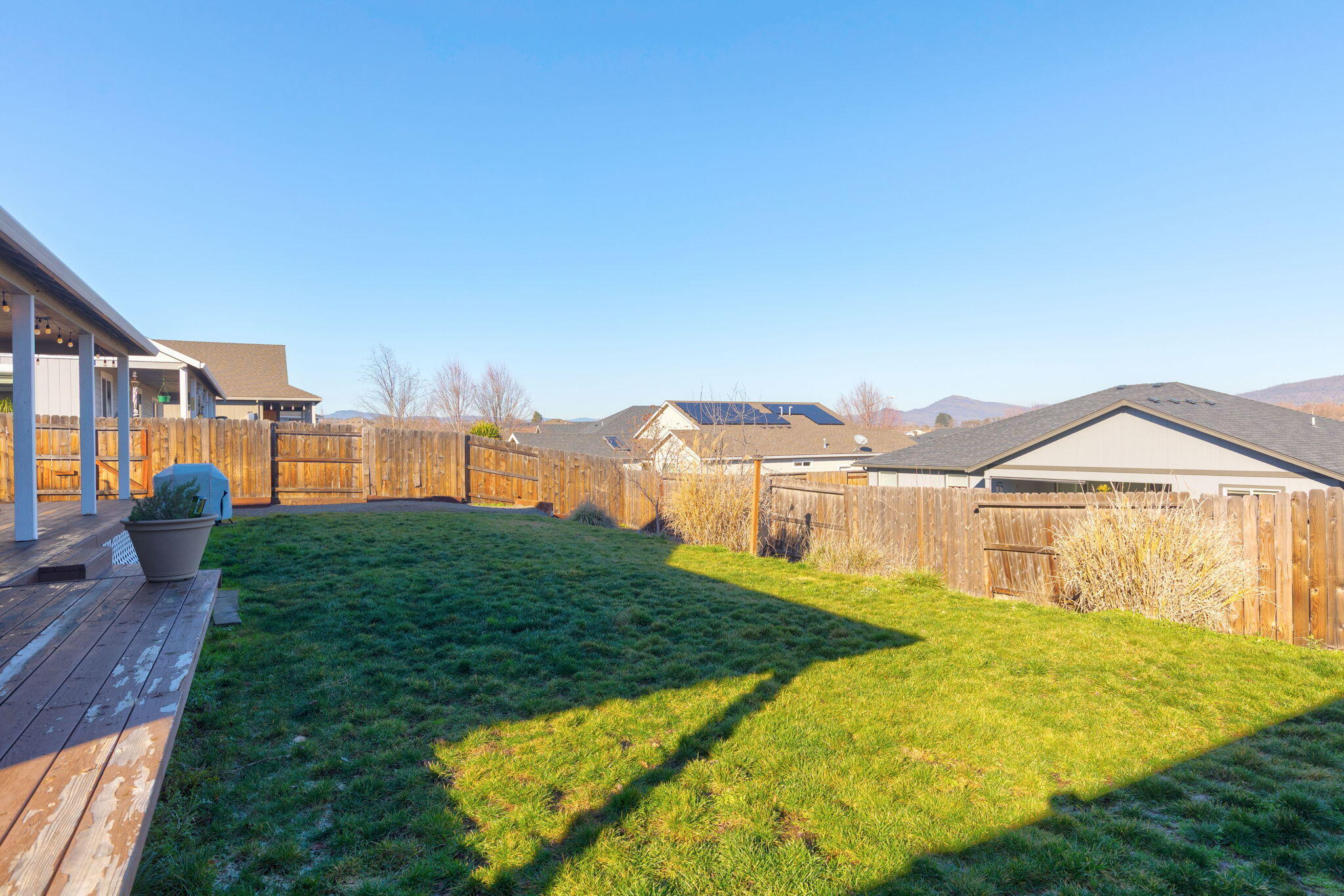 110 Linton Way Eagle Point, OR 97524 - Photo 32 of 41 a view of a house with a backyard and a garden
