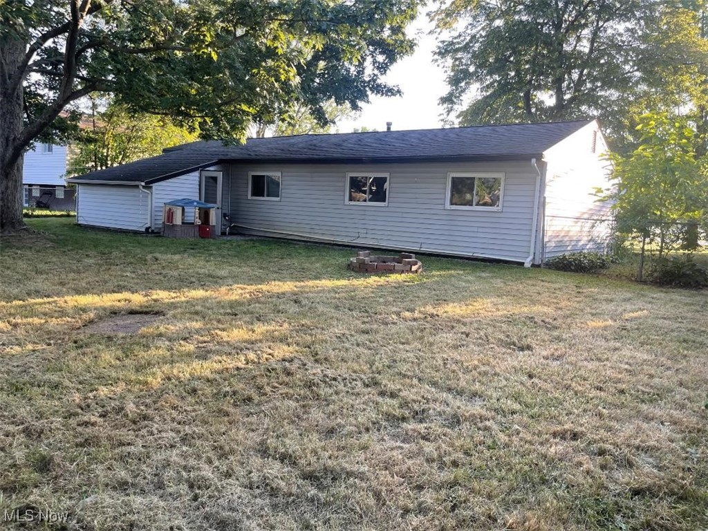 5741 Jaycox Road North Ridgeville, OH 44039 - Photo 22 of 23 Rear view of house with a yard