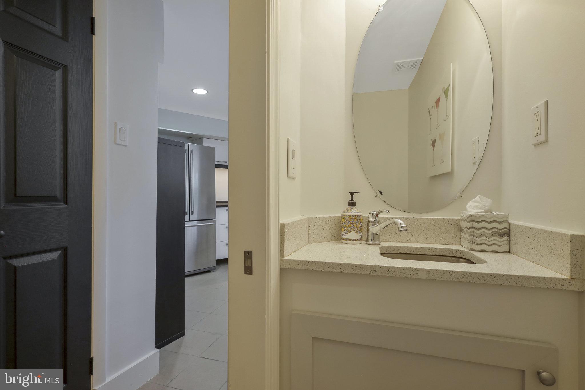 116 Commerce Street Alexandria, VA 22314 - Photo 30 of 50 Sleek modern bathroom entrance.