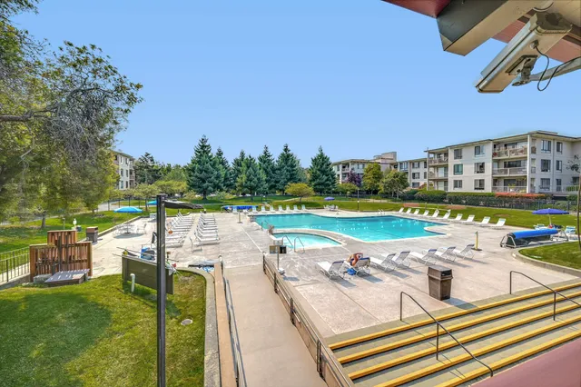a view of a swimming pool with a patio