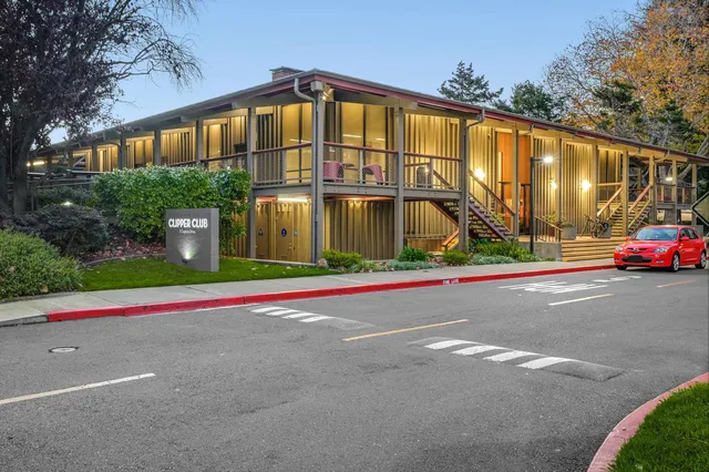 a view of a house next to a yard