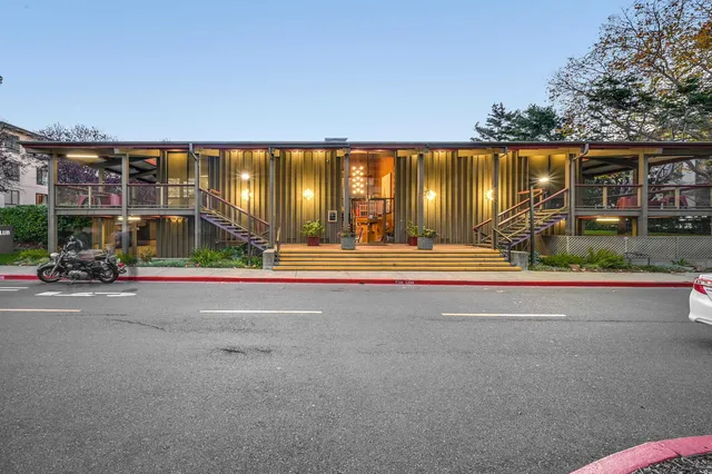 a room with pool table and windows