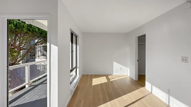 a bedroom with a bed and a cabinets