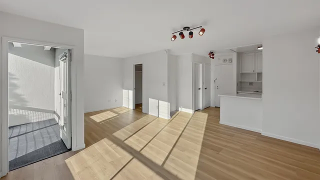 a view of a balcony with wooden floor