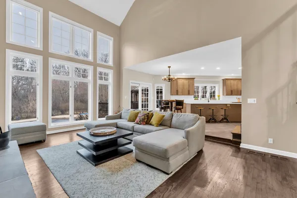 a kitchen with stainless steel appliances granite countertop a sink a stove and cabinets