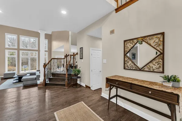 a living room with furniture a table and a potted plant