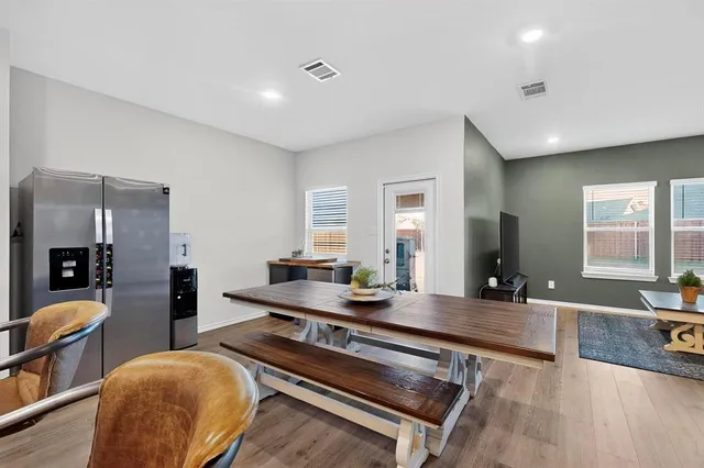 a room with furniture a rug and a large window