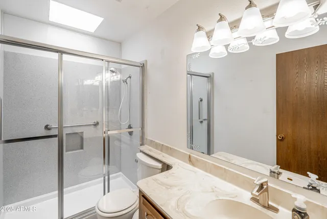 a room with pool table and windows