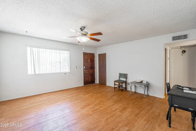 a view of a livingroom with a workspace