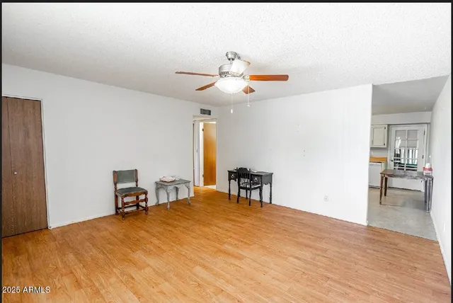 a bedroom with a bed and a table in it