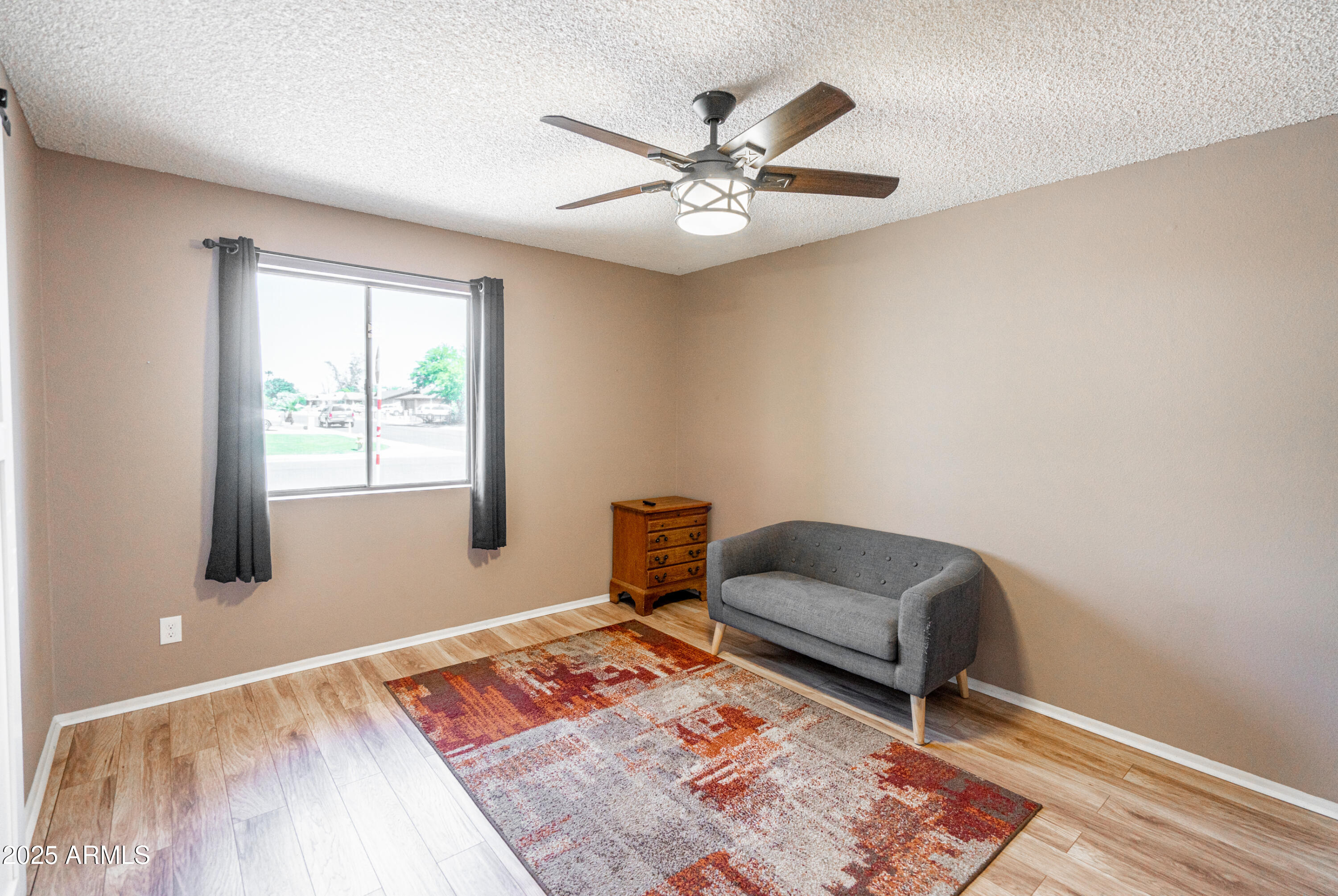 18422 North 30th Lane Phoenix, AZ 85053 - Photo 9 of 16 a living room with furniture and a window