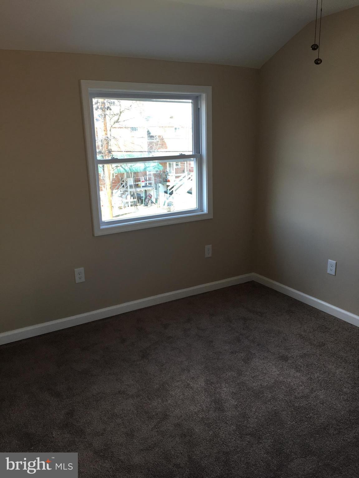 926 Arncliffe Road Baltimore, MD 21221 - Photo 12 of 24 an empty room with a window