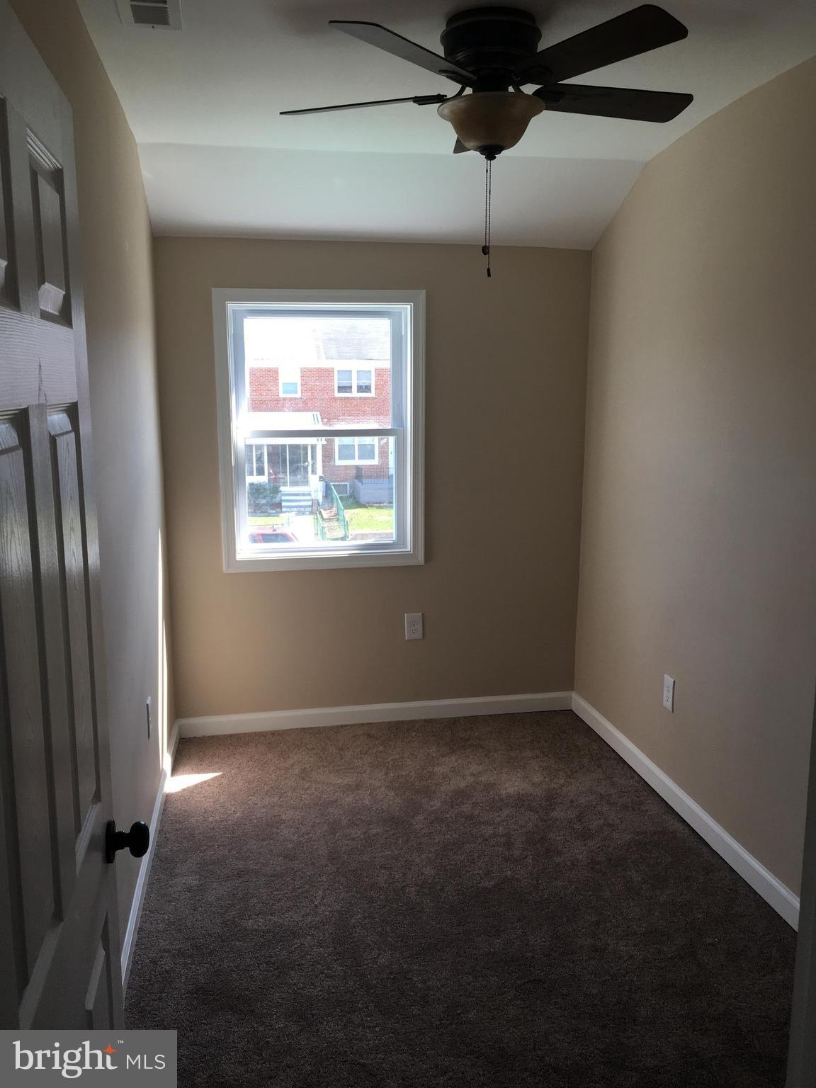 926 Arncliffe Road Baltimore, MD 21221 - Photo 16 of 24 a view of an empty room with a window
