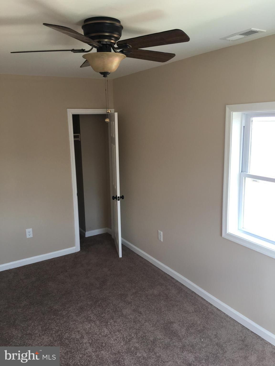 926 Arncliffe Road Baltimore, MD 21221 - Photo 17 of 24 a view of an empty room with a window