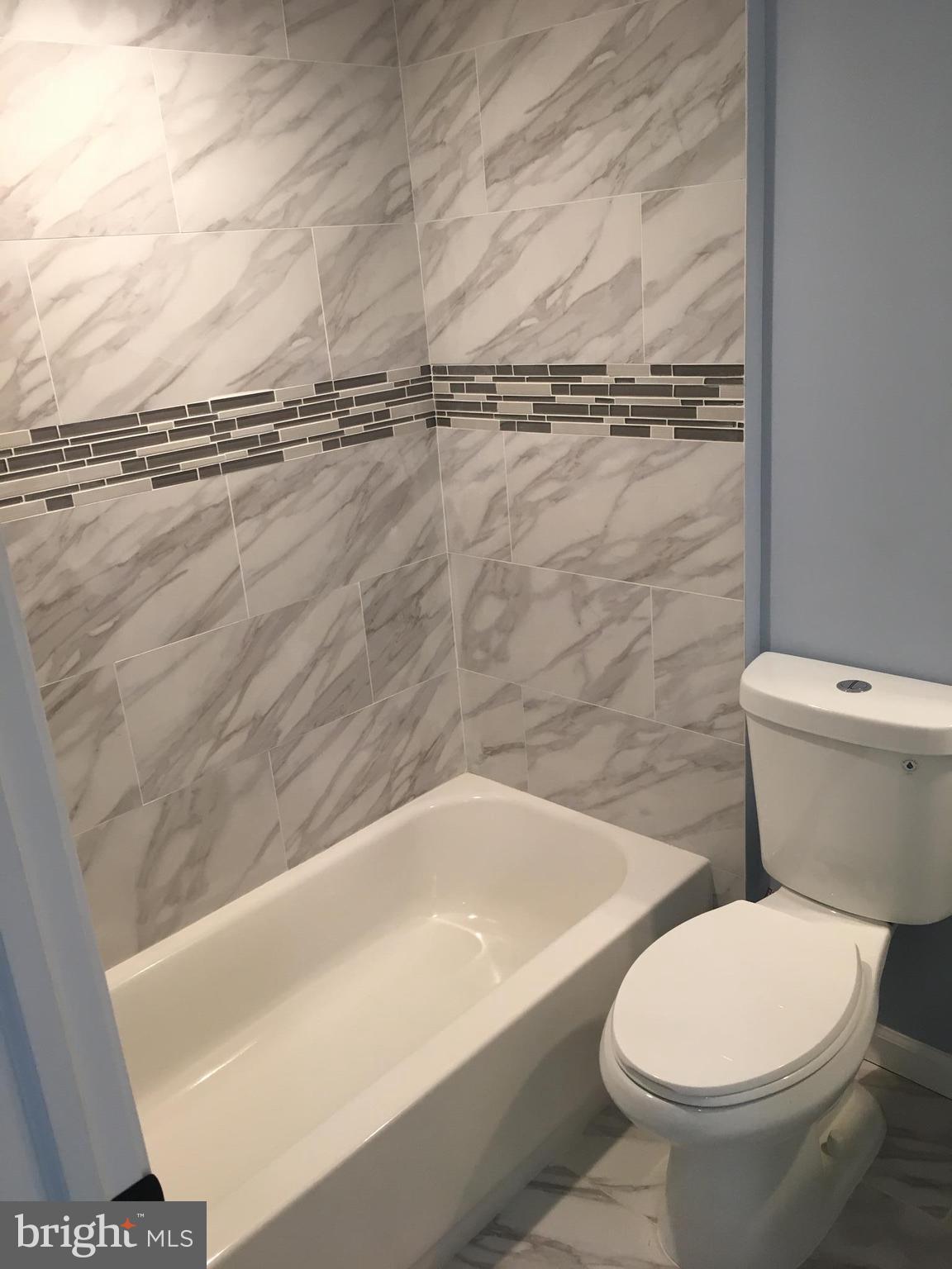 926 Arncliffe Road Baltimore, MD 21221 - Photo 19 of 24 a bathroom with a toilet and a bathtub