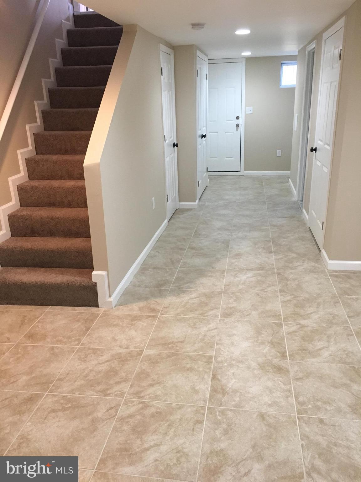 926 Arncliffe Road Baltimore, MD 21221 - Photo 23 of 24 a view of an empty room with stairs