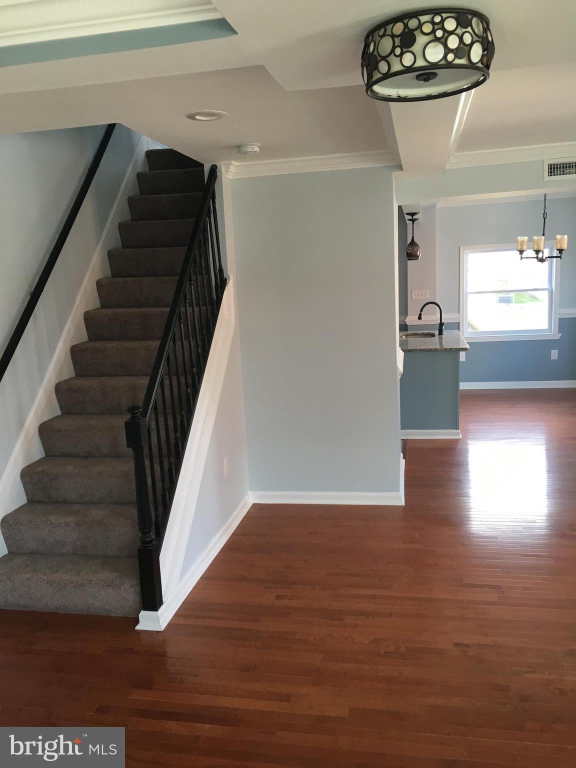 926 Arncliffe Road Baltimore, MD 21221 - Photo 4 of 24 a view of entryway and hall with wooden floor