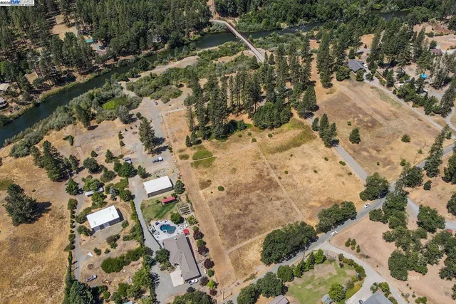 a aerial view of a house with a yard