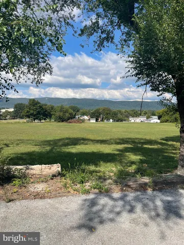 a view of a golf course with a lake