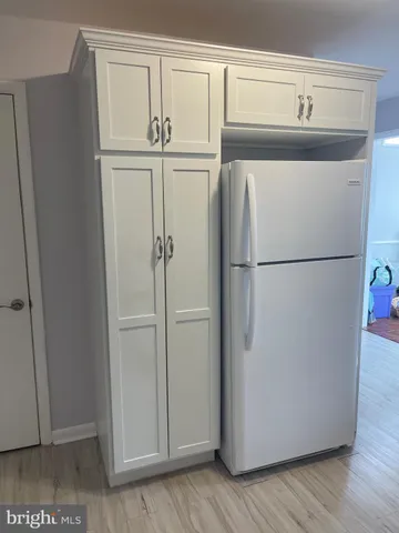 a view of an empty room and fire place