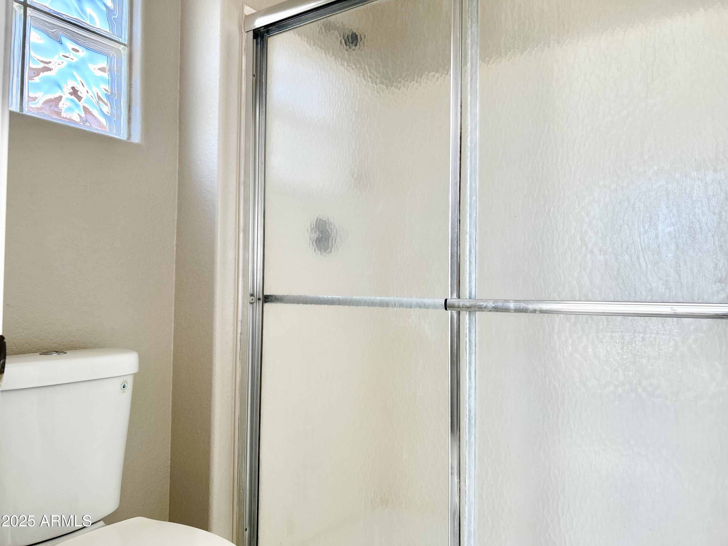 437 West San Angelo Gilbert, AZ 85233 - Photo 14 of 21 a bathroom with a shower and a toilet