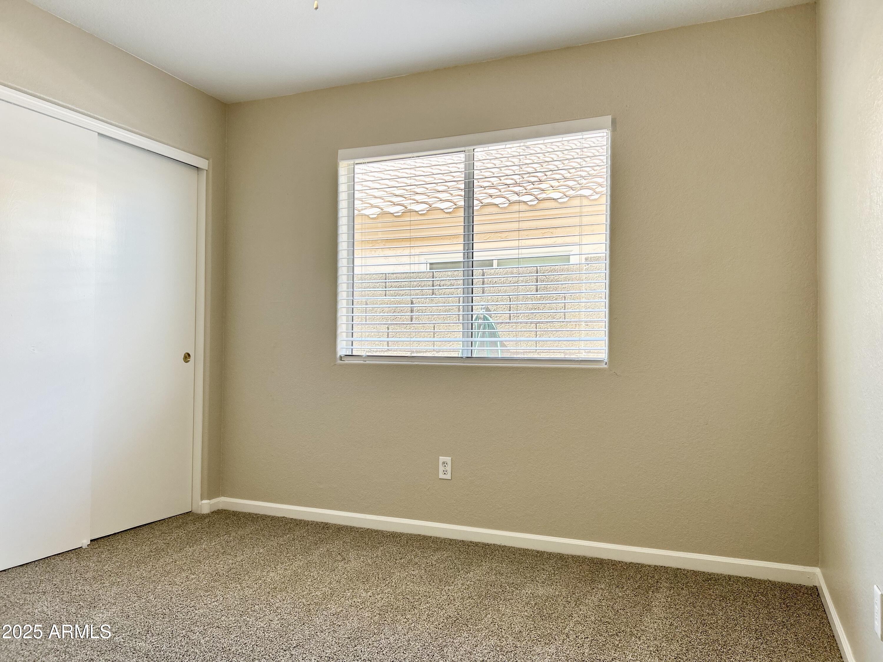 437 West San Angelo Gilbert, AZ 85233 - Photo 15 of 21 an empty room with a window