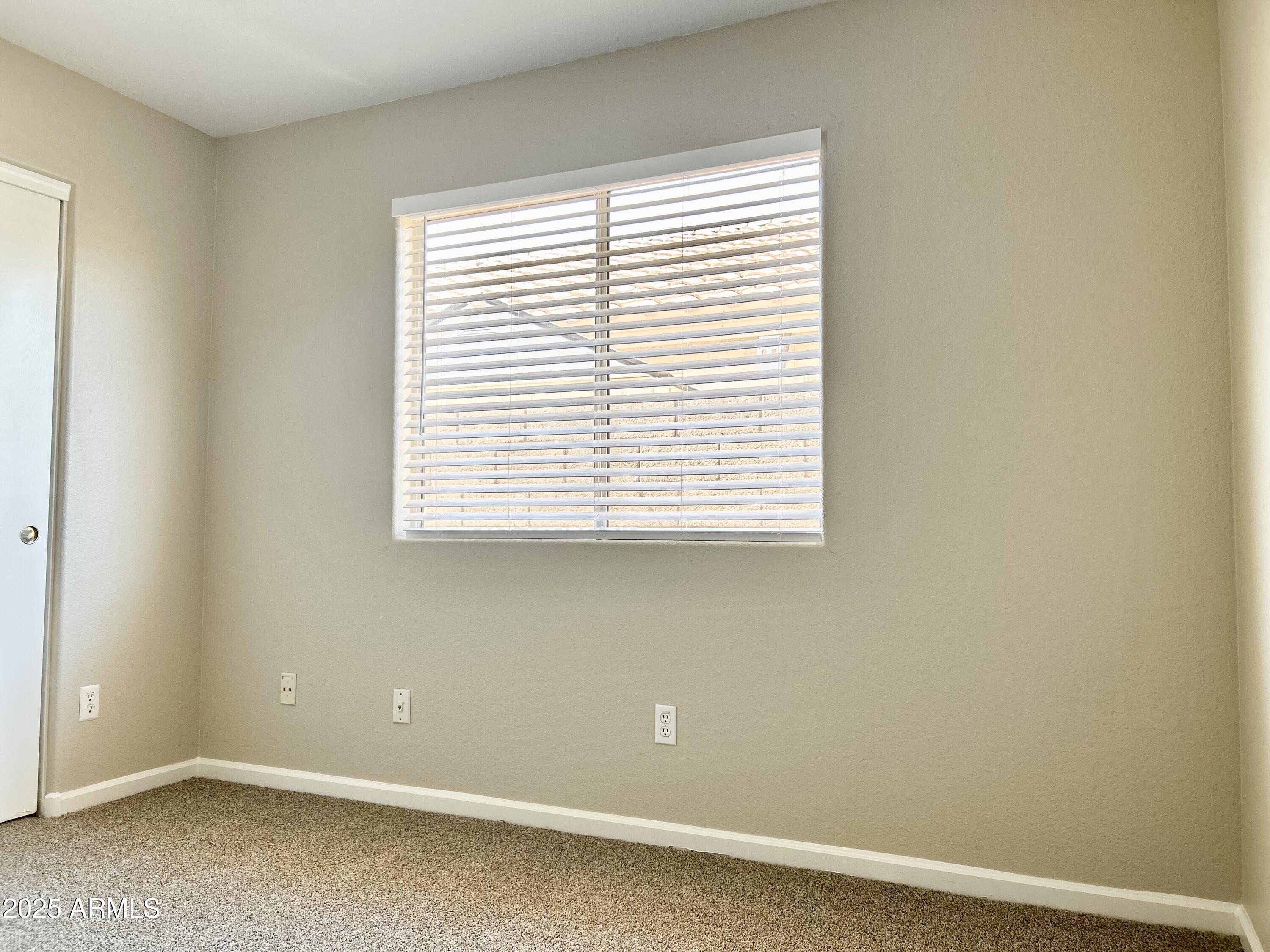 437 West San Angelo Gilbert, AZ 85233 - Photo 17 of 21 an empty room with a window