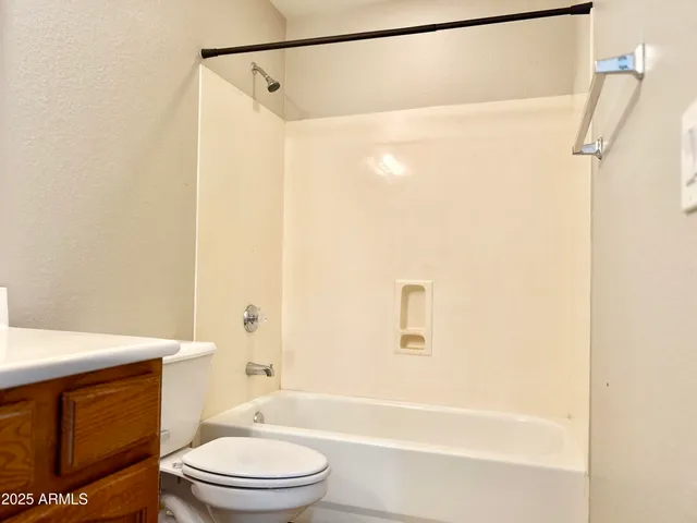 a bathroom with a toilet a sink and a bathtub