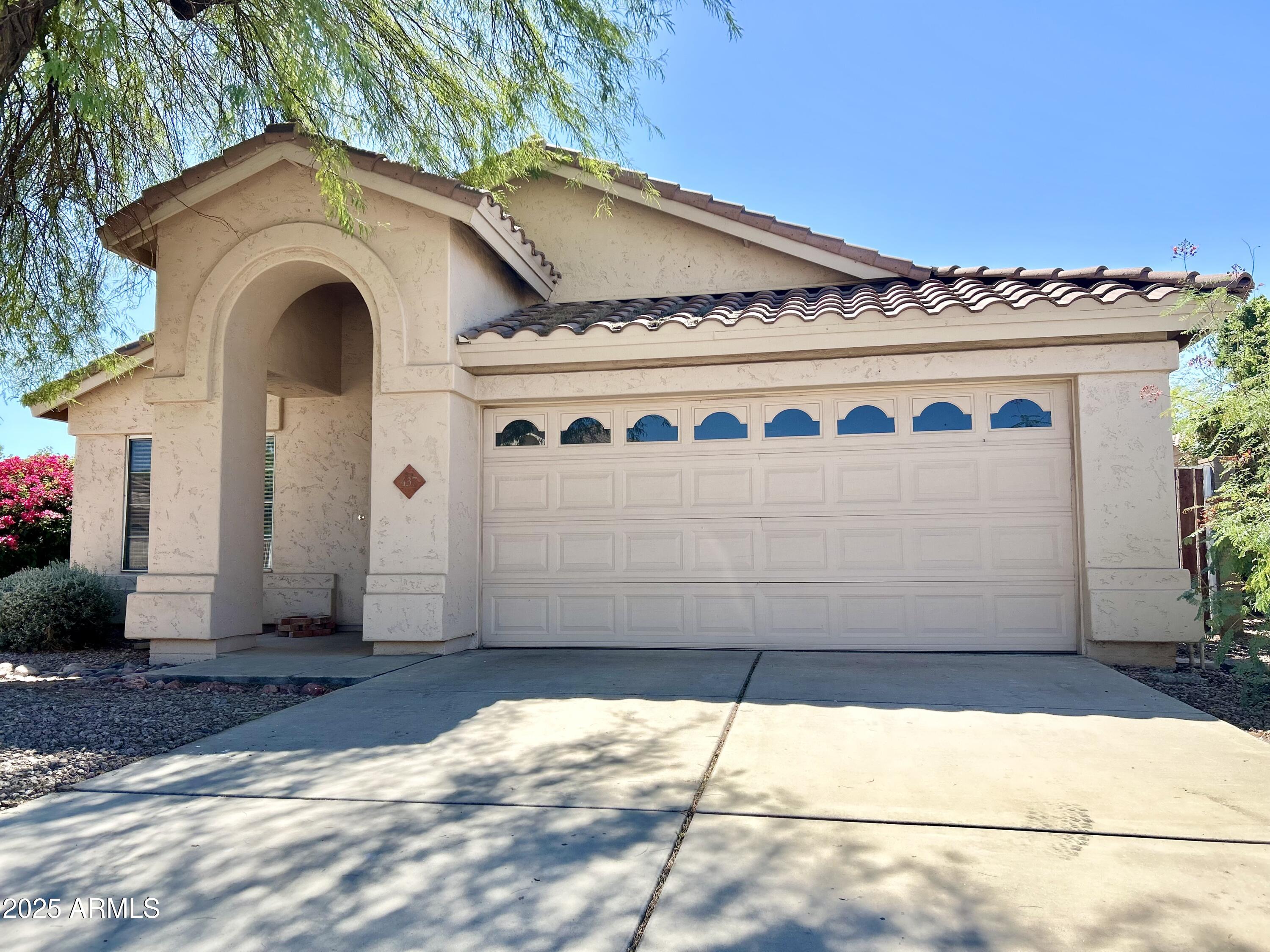 437 West San Angelo Gilbert, AZ 85233 - Photo 2 of 21 a front view of a house with a garden and entryway