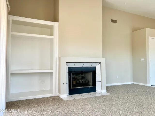 a living room with a fireplace